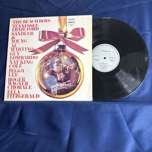 Black and Gold Vinyl Record with Festive Cover